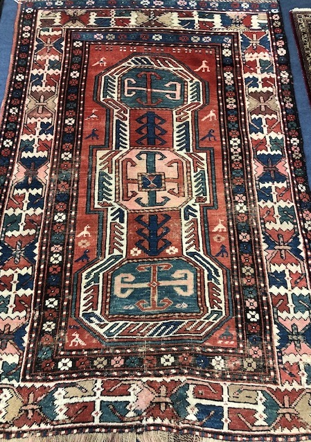 A Kazak red, blue and ivory ground rug 189 x 130cm